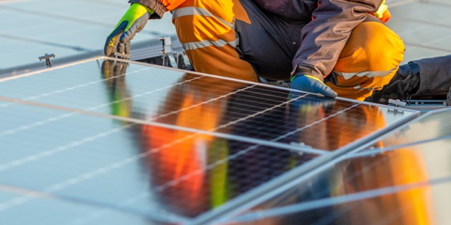A worker fitting solar panels