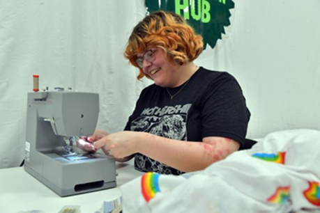 Judith Whitehouse, The Central Operations Team, practicing her sewing skills.