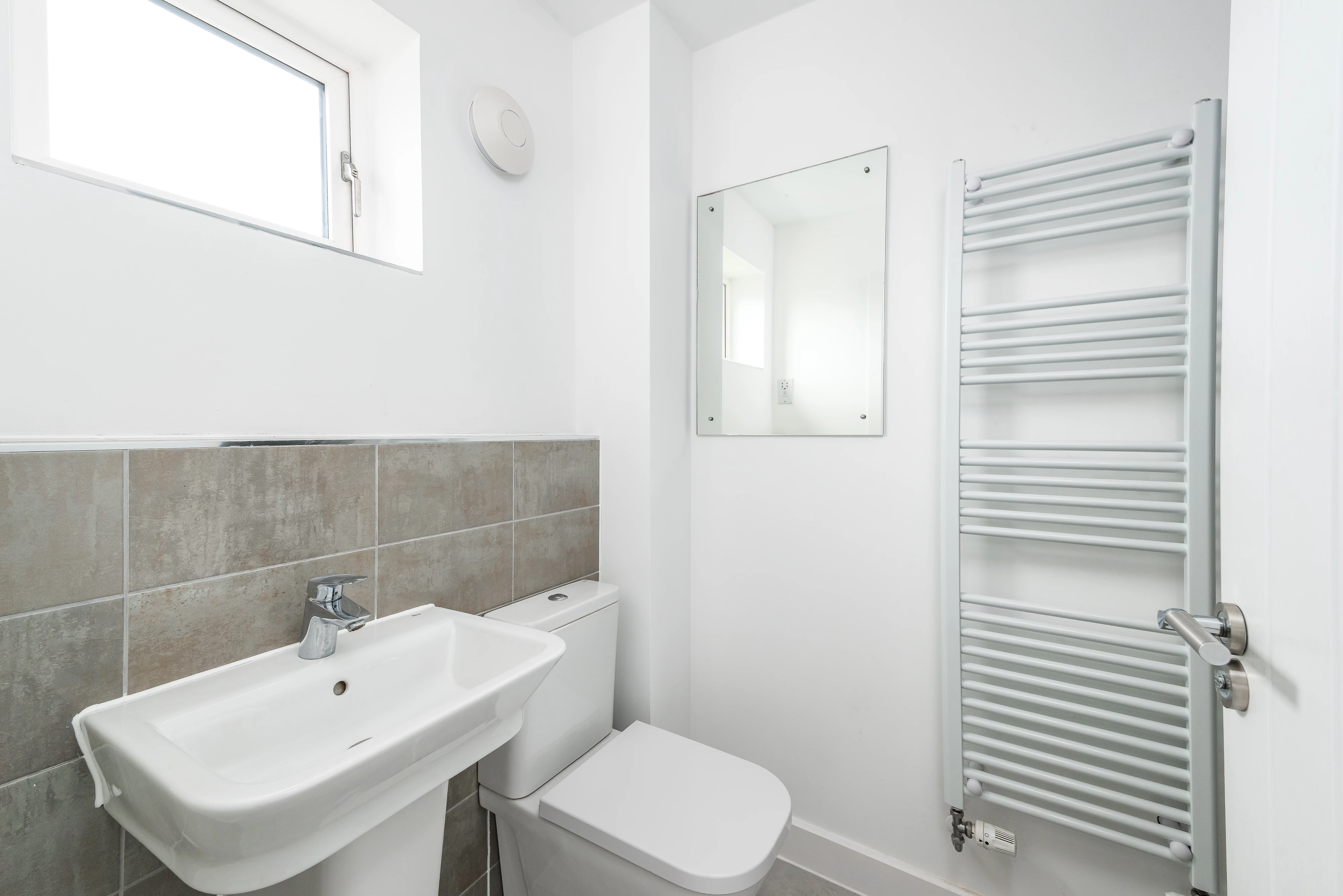 White bathroom basin and toilet
