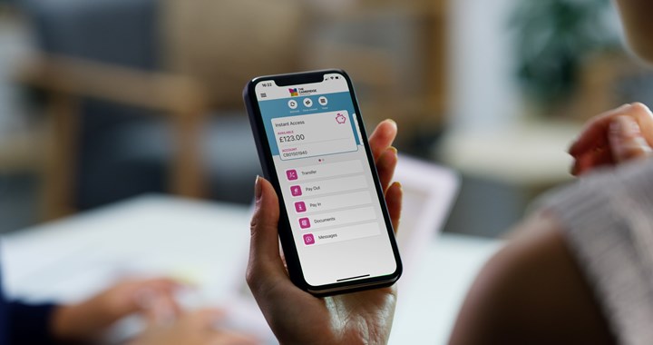 Women viewing Cambridge Money App on her phone