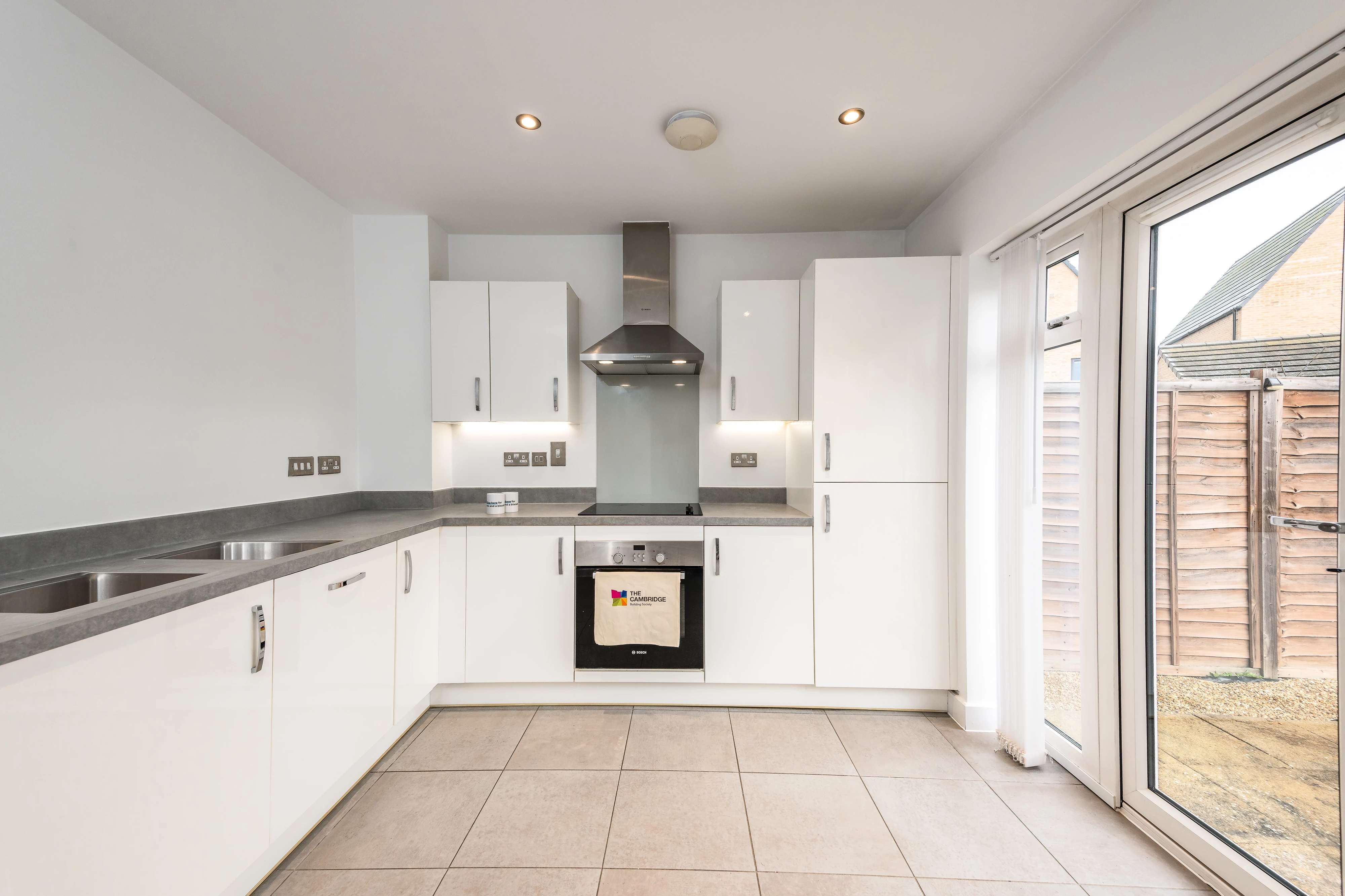Kitchen inside a house with white cupboards