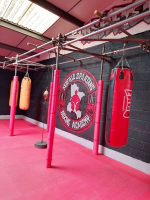 Boxing space with punching bags at Ashfield Spartans Boxing Academy