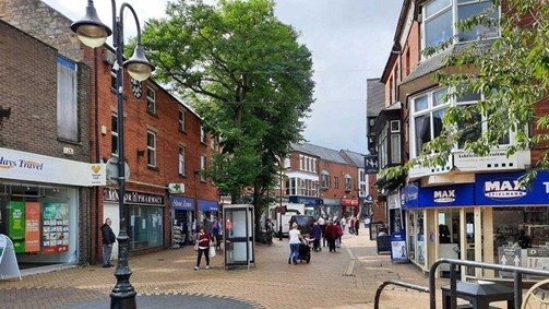 A pedestrianised street with shops in Sutton in Ashfield town centre