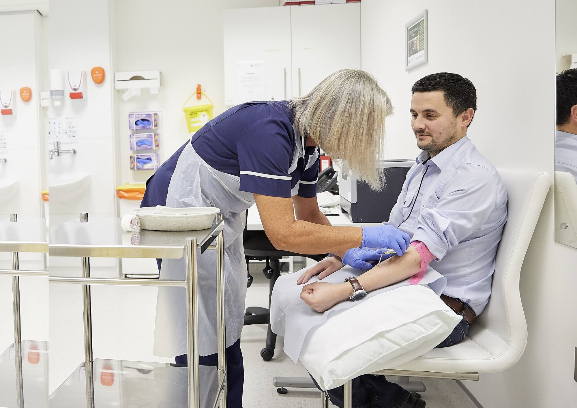 Patient and a nurse in a blood test