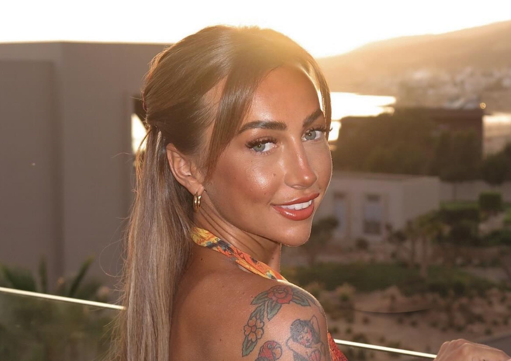 Molly Foster on a sunset background