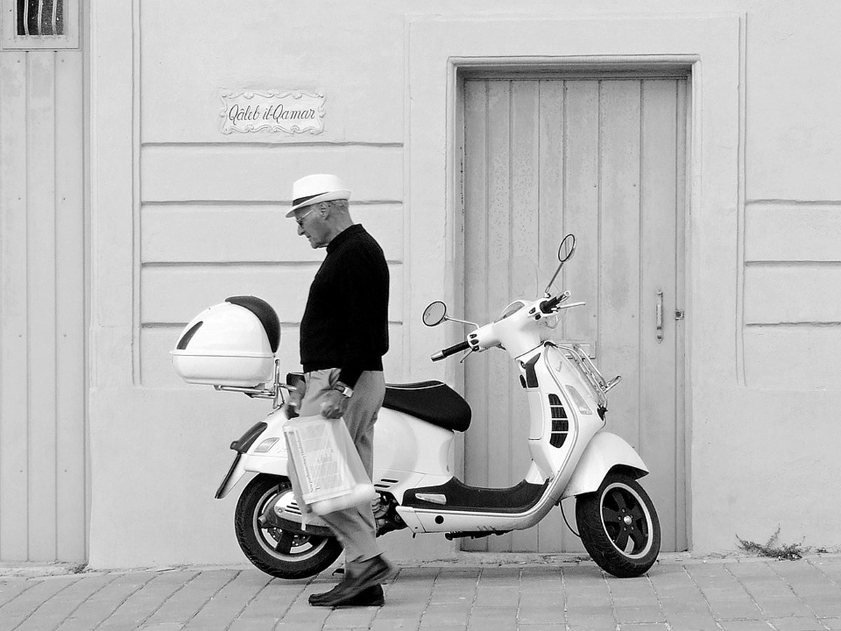 https://pixabay.com/en/vespa-scooter-man-walking-1073518/