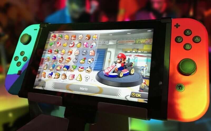 A Nintendo Switch console showing the Nintendo game Mario Karts on the screen.