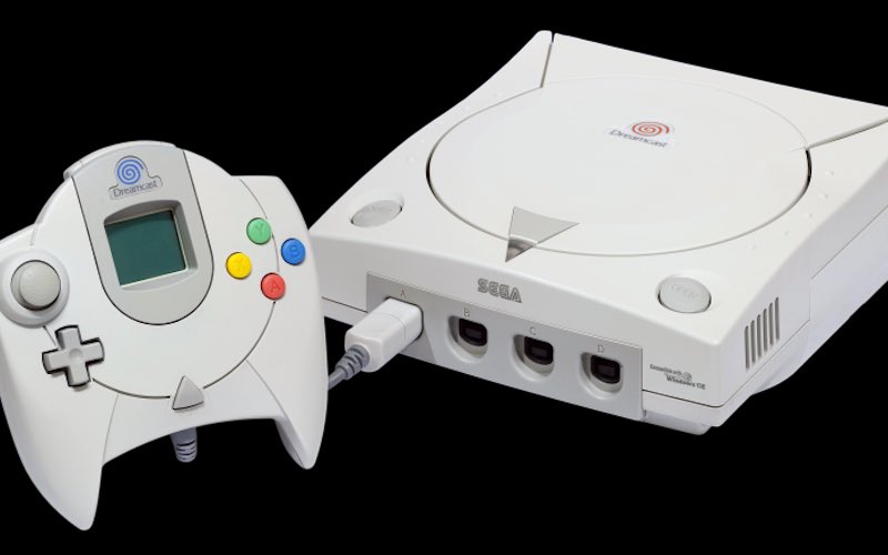 A white Sega Dreamcast console and controller
