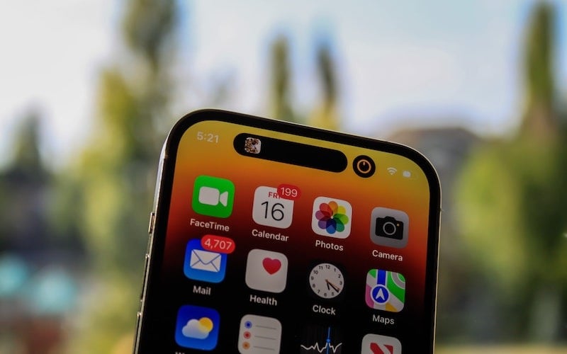Close up of iPhone 14’s dynamic island notch on front of the screen.