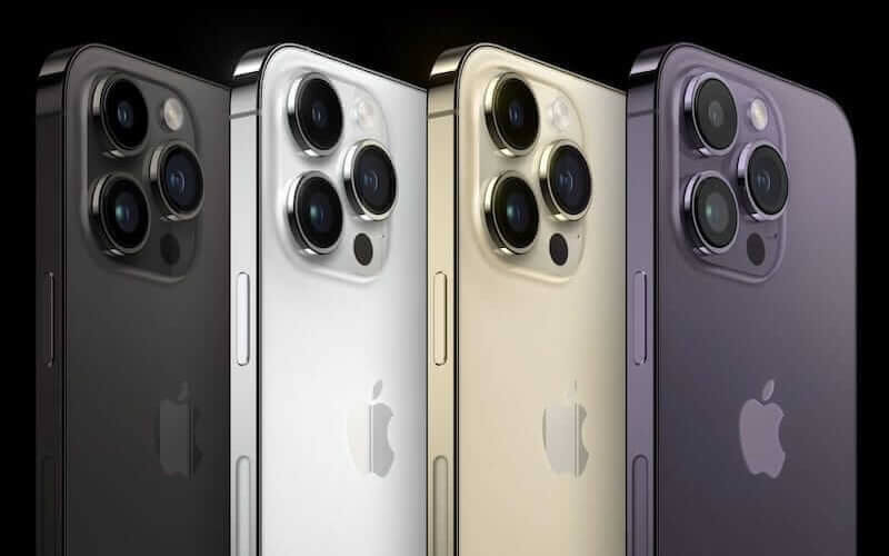 A render of four iPhone 14 models stood upright in a line. All models are different colours, with black, white, gold and purple models.