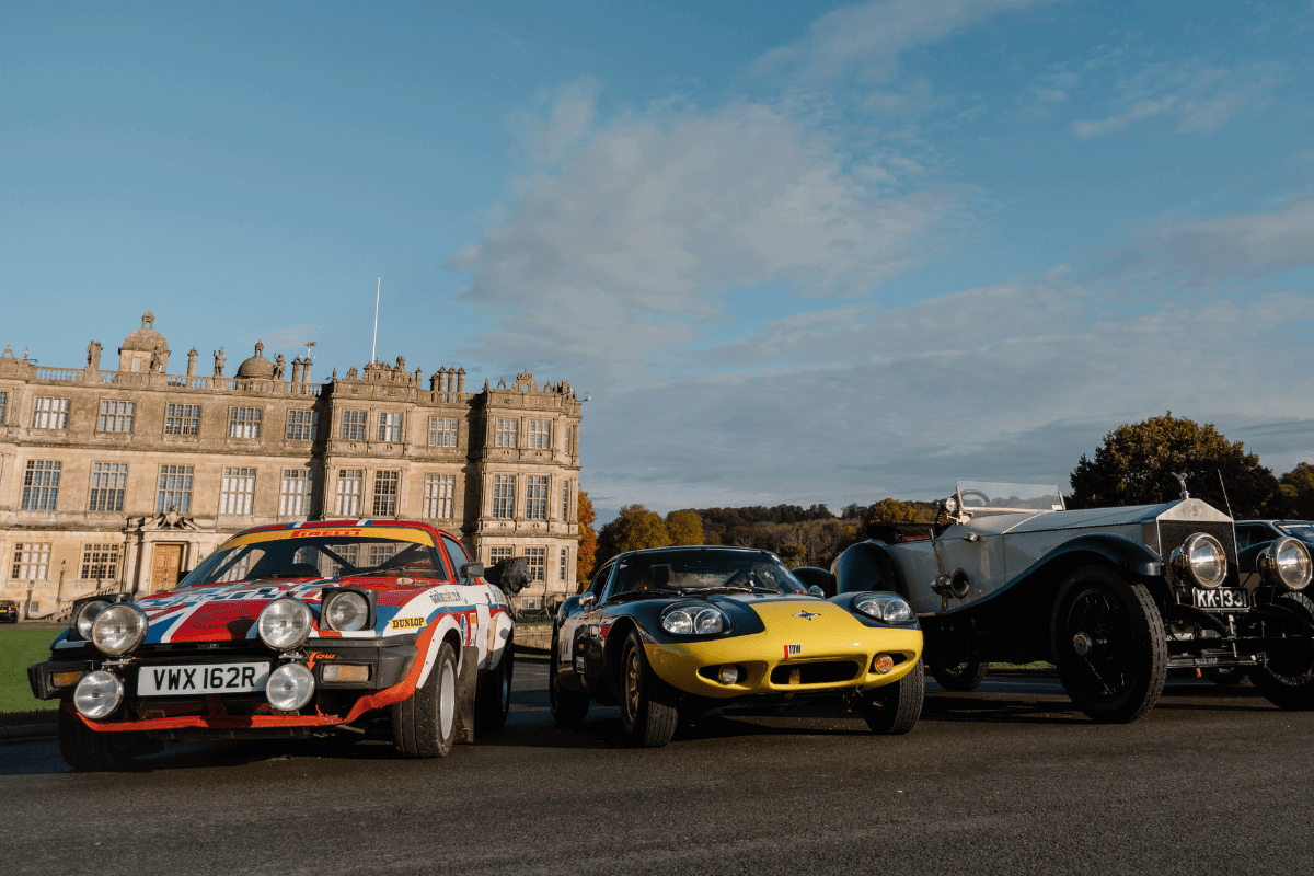 Three cars parked in front of Longleat House to promote the Motor Show Weekender
