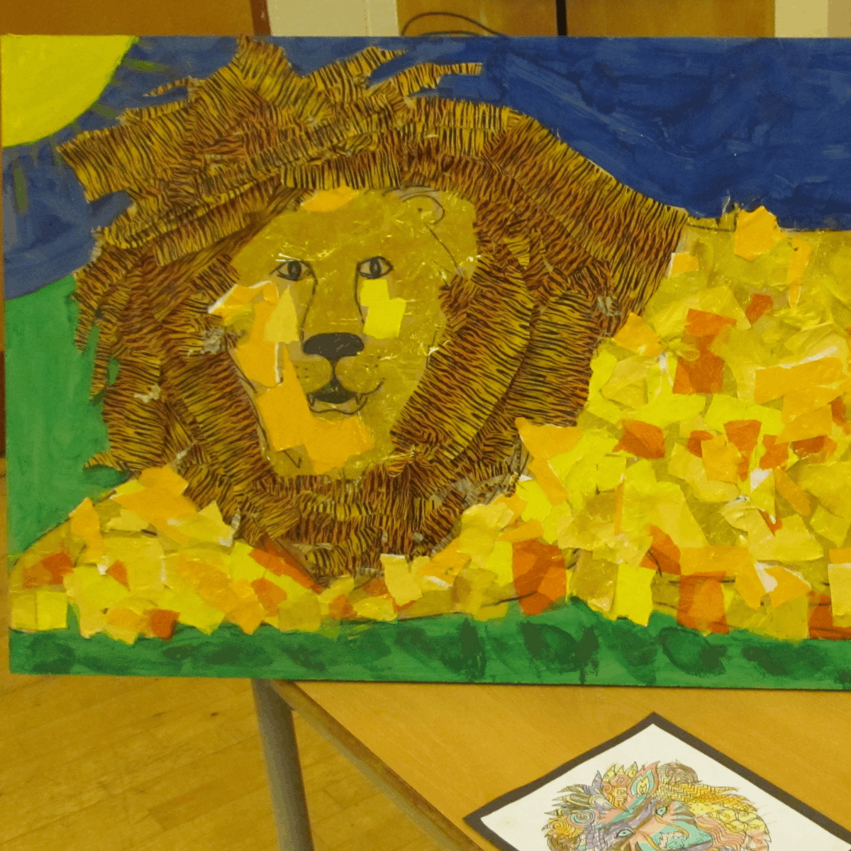 A collage of a lion laying in grass beneath the sun and blue sky