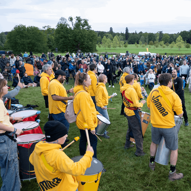 Samba band playing to a crowd of people