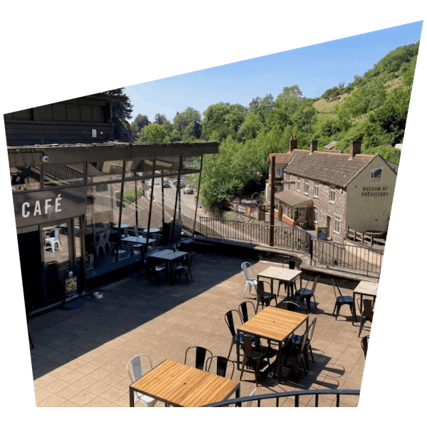 view of the outside eating and drinking area at Gough's cafe at cheddar gorge and caves in somerset 