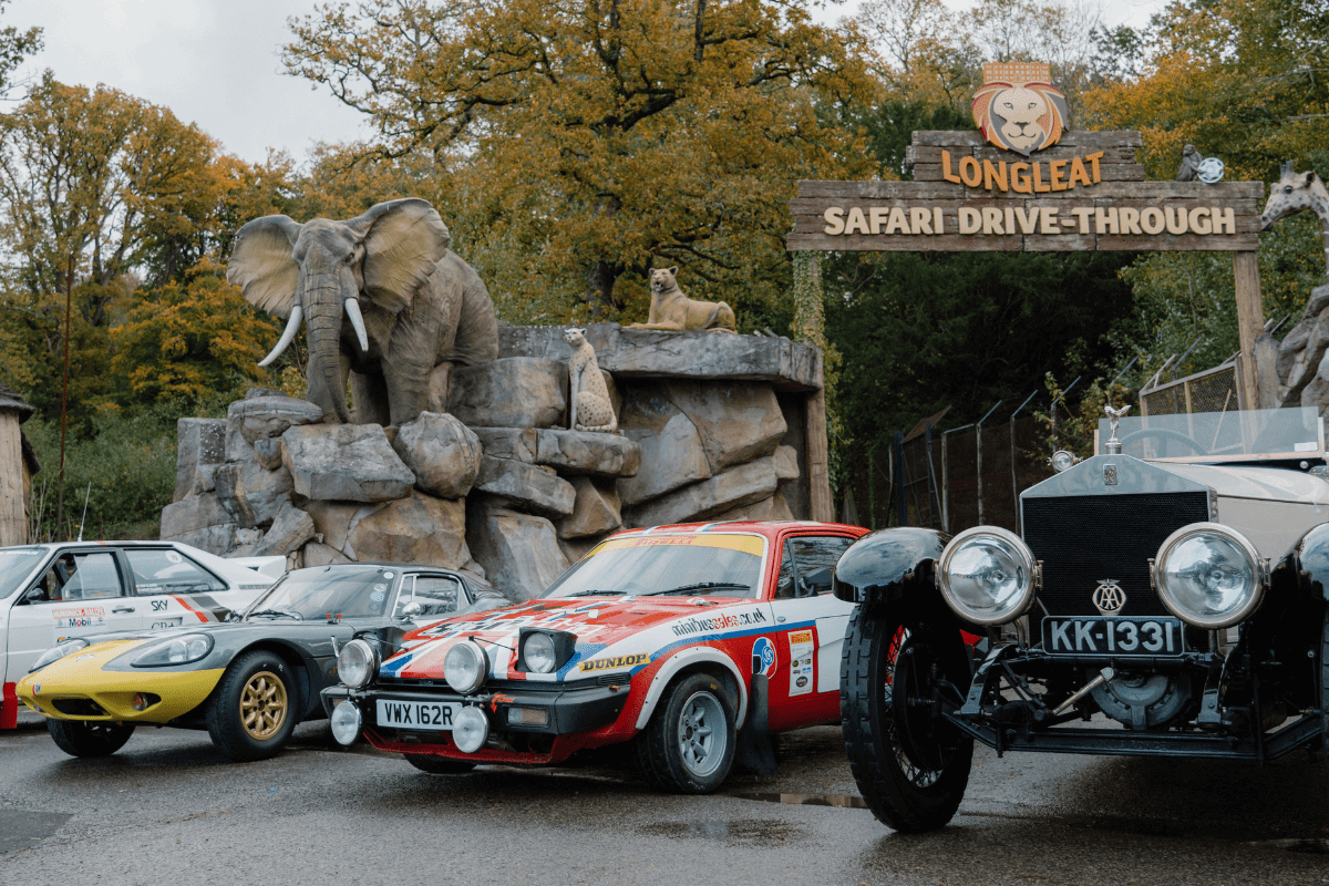 A range of classic, rally and vintage cars park in front of the Drive-Through Safari entrance to promote the Motor Show Weeekender