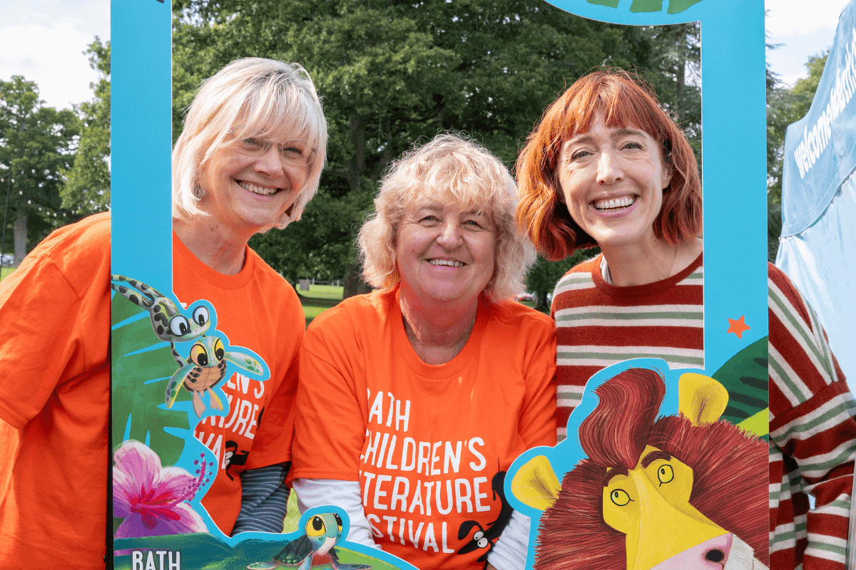 three ladies inside a Bath Children's Literature Festival selfie frame