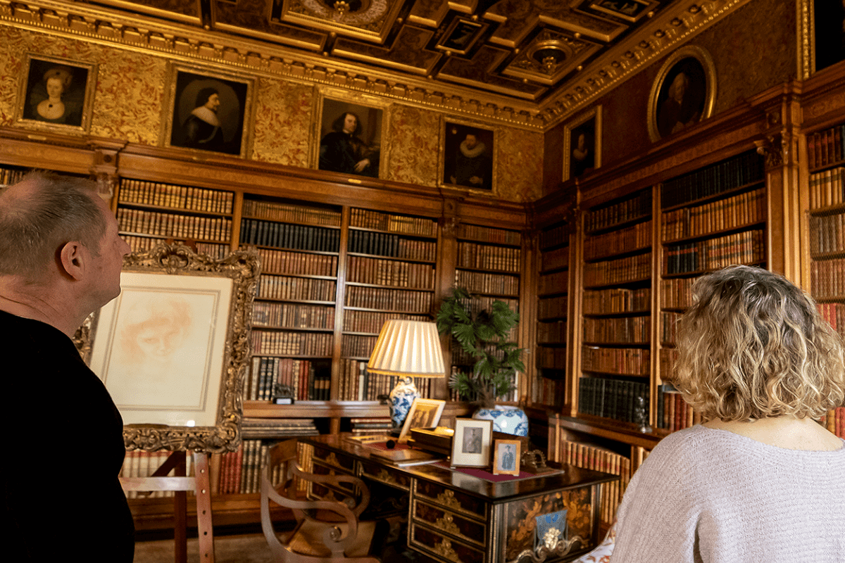 Two visitors admire one of the grand rooms of Longleat House