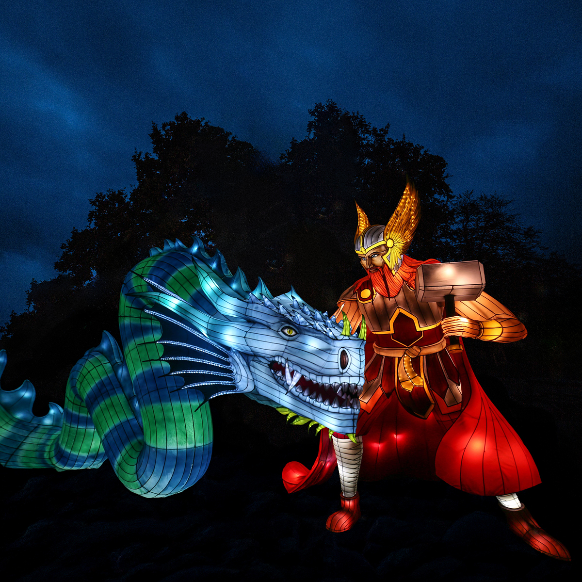 A dragon and legend in lantern form, lit against a dark night sky