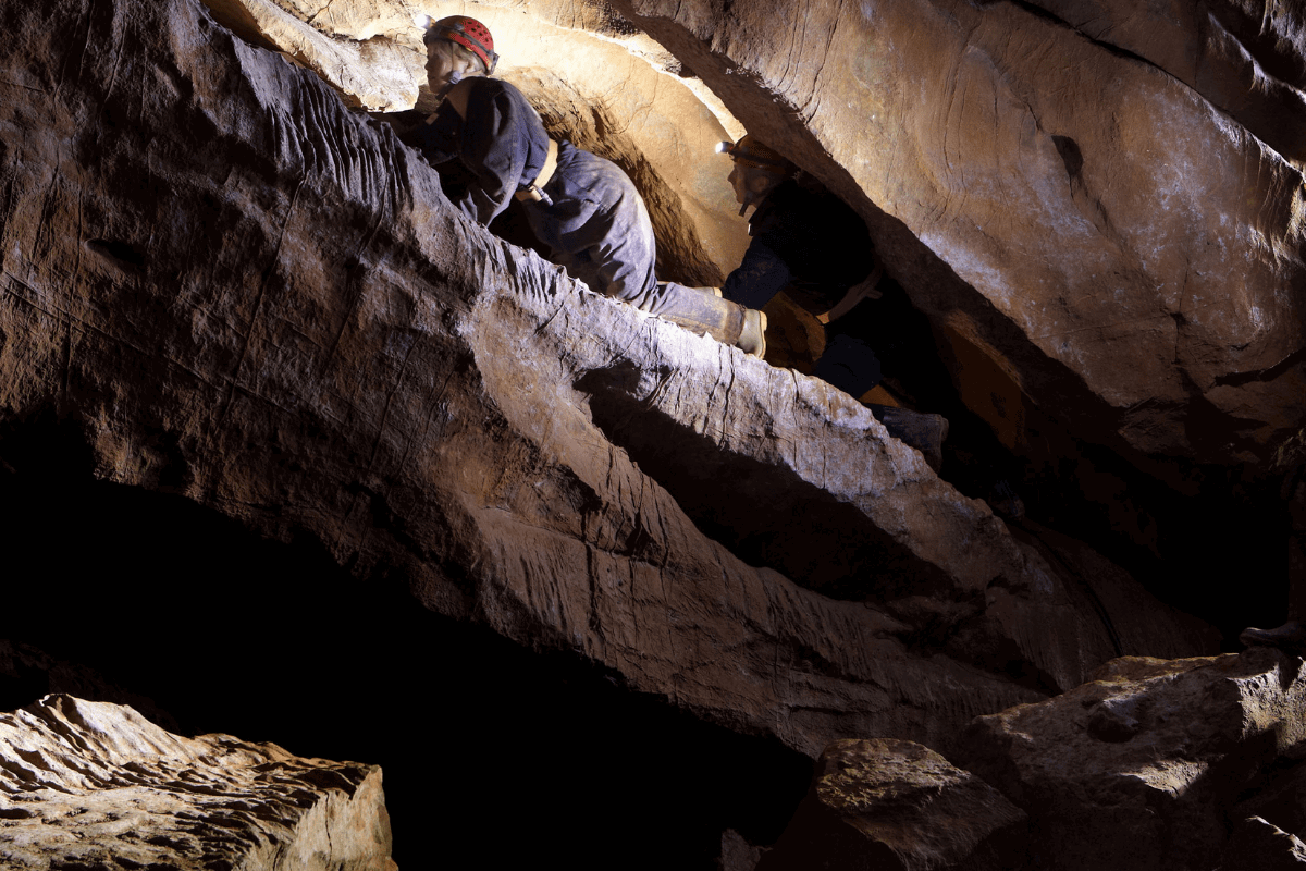 An adventure caver enjoying the activity at Cheddar