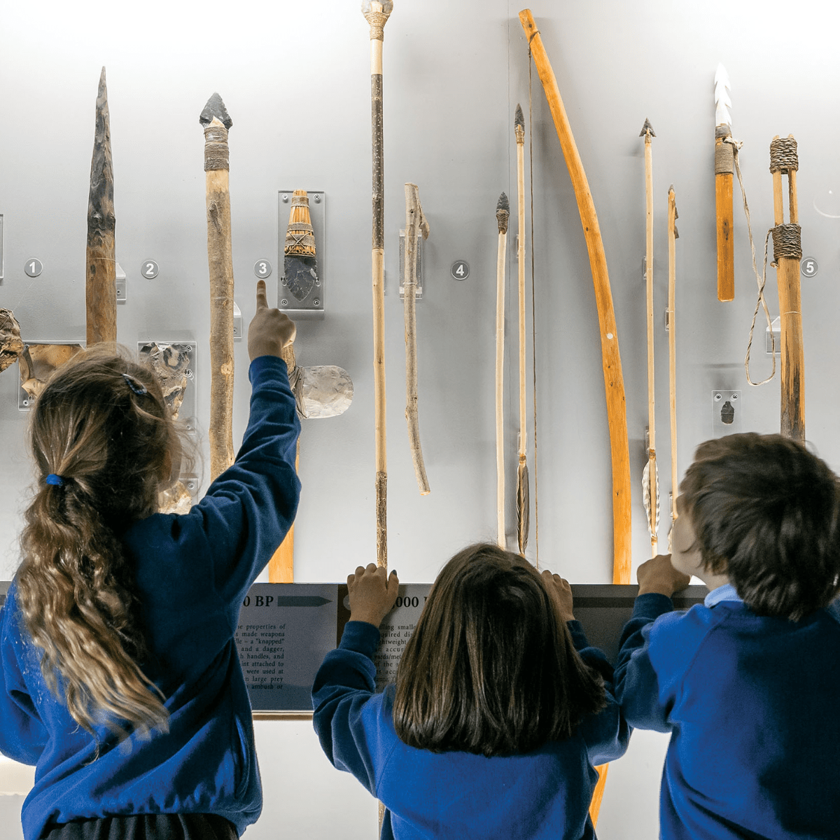 Young school children admire exhibit in the museum