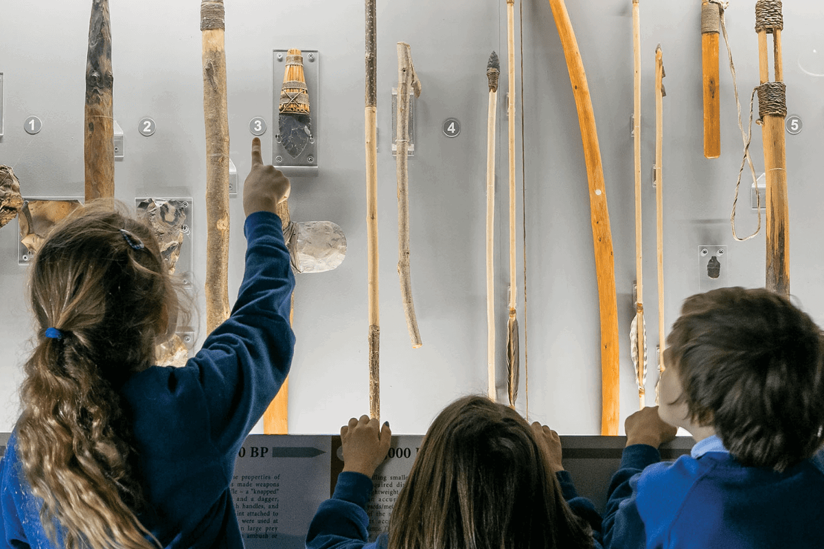 Young school children admire exhibit in the museum