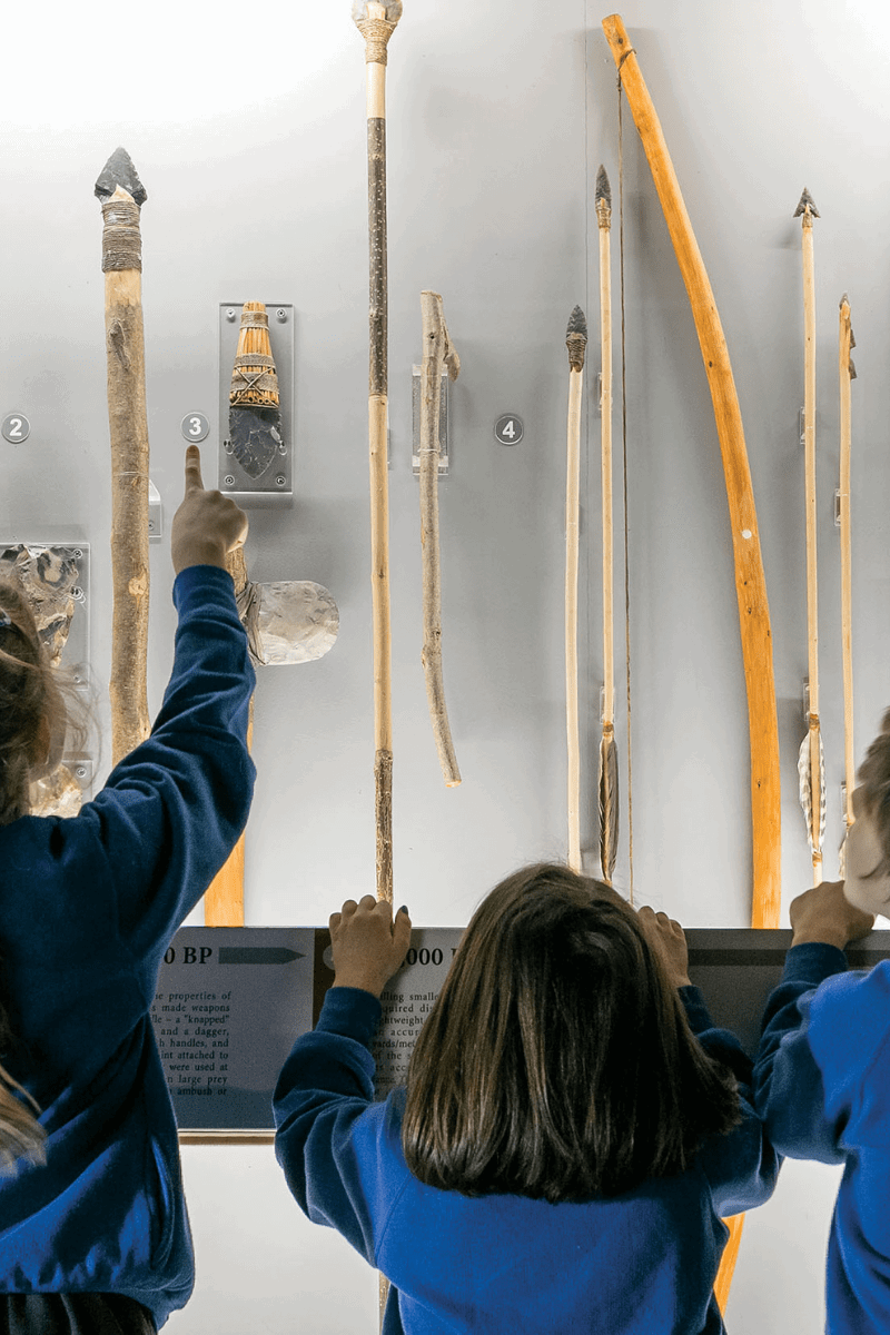 Young school children admire exhibit in the museum