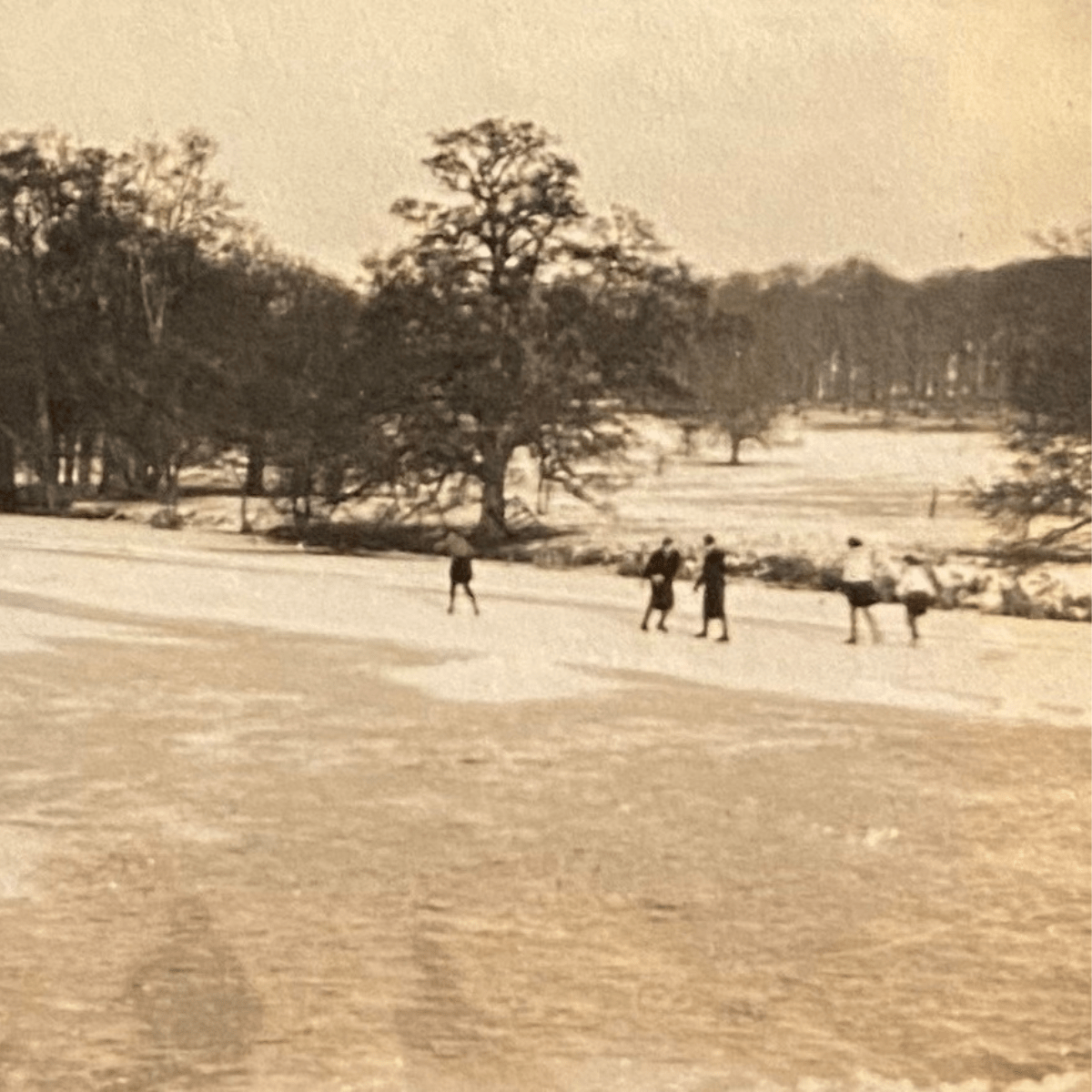 A 1940's photograph of people ice skating in the grounds of Longleat House
