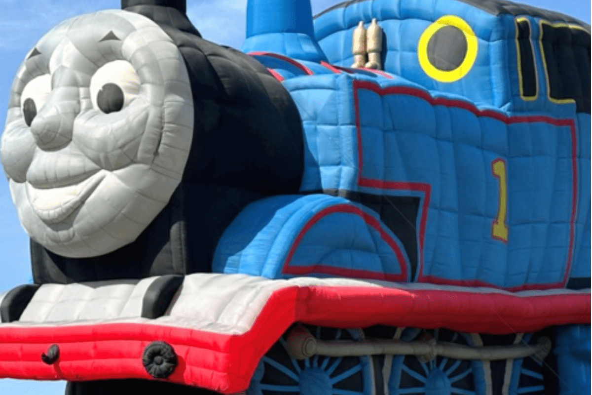 Thomas the tank engine in balloon form. A large blue, steam train with friendly face