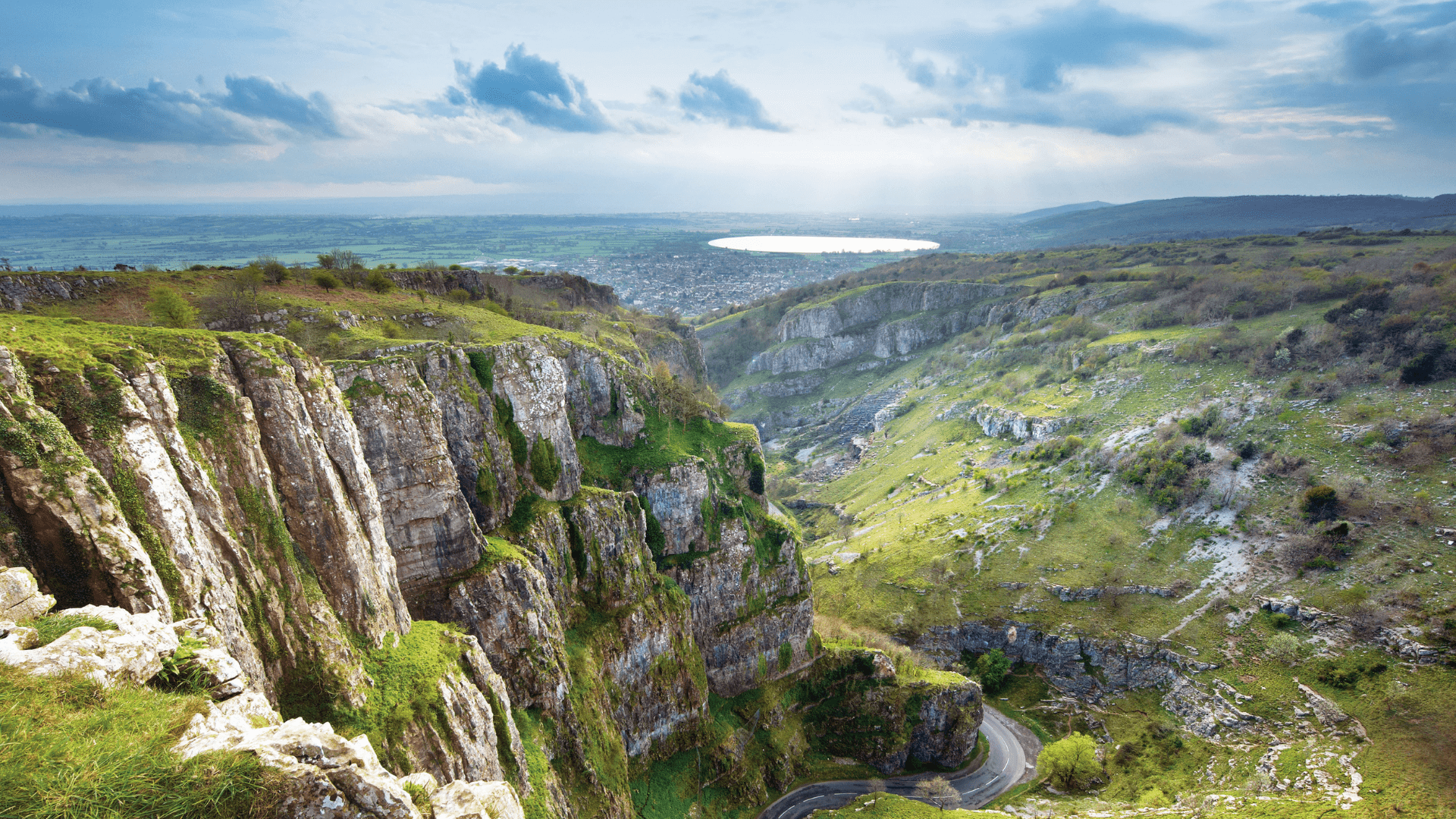 A look out into the lush and vast landscape of cheddar gorge and down into the winding roads below