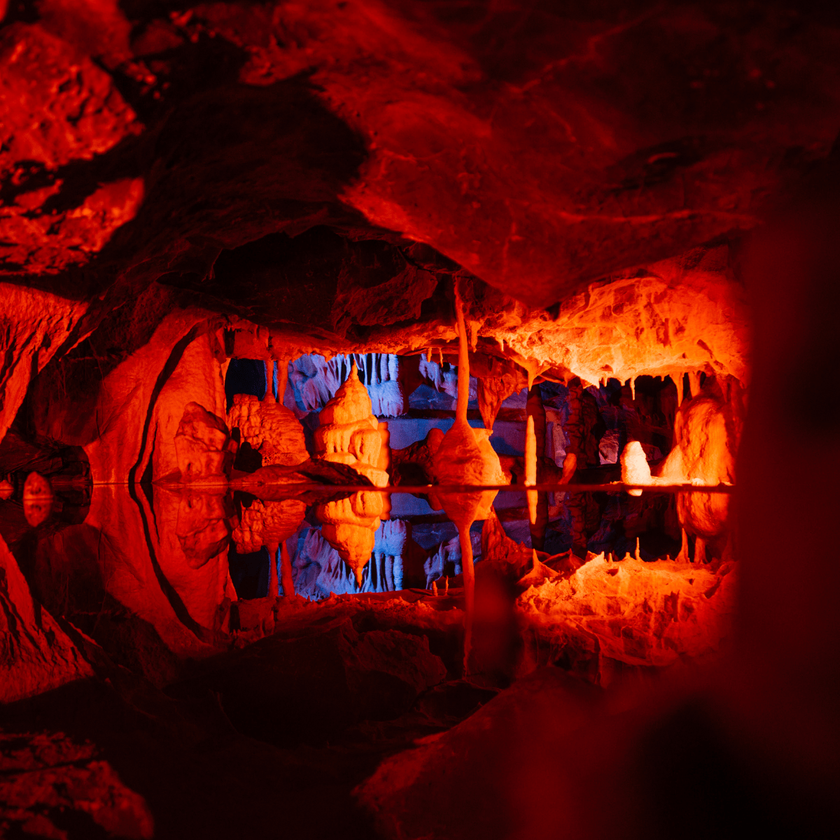 The light projections colouring the walls of Cox's cave with bright and warm reds