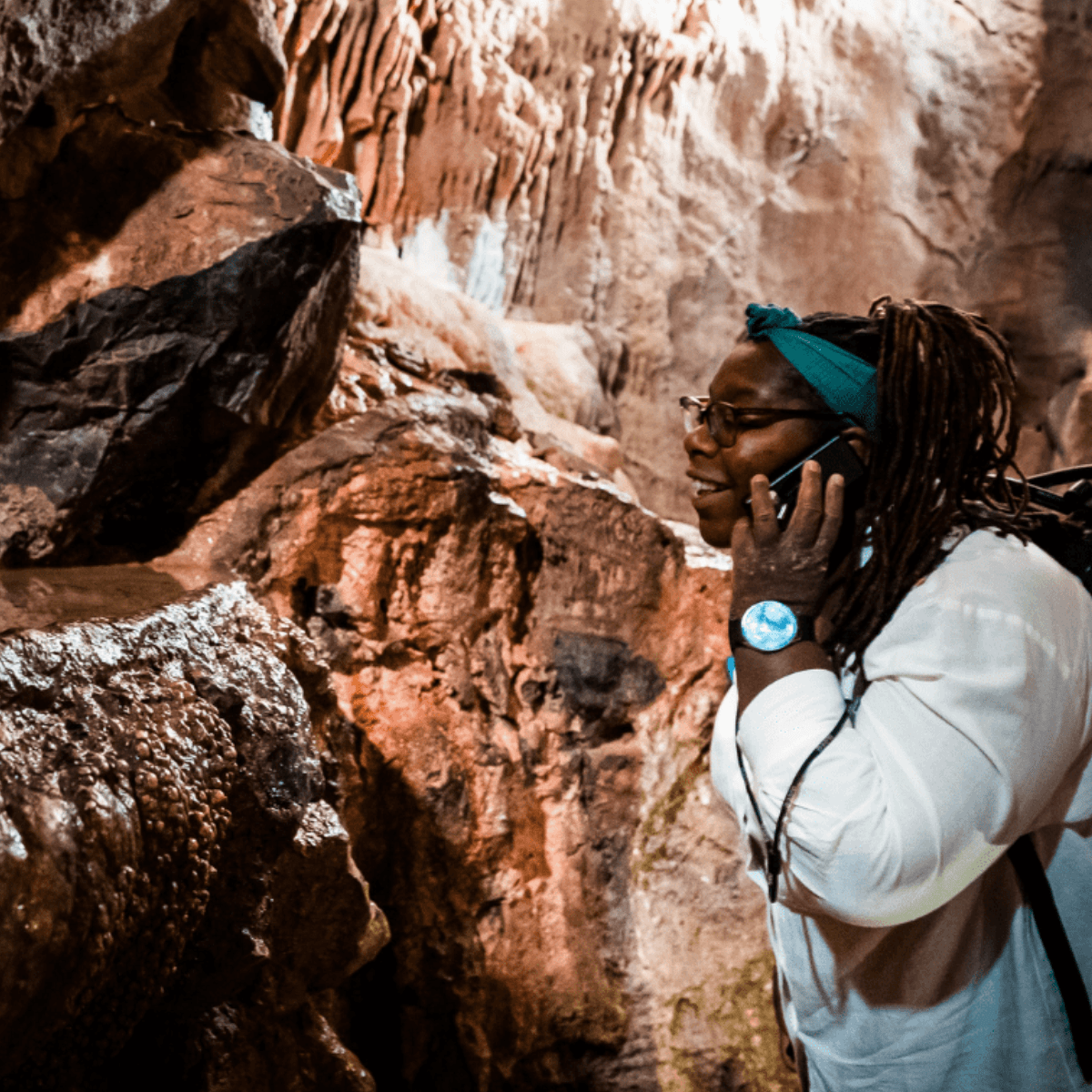 A visitor uses the audio guides inside Gough's Cave to find out more information about the attraction
