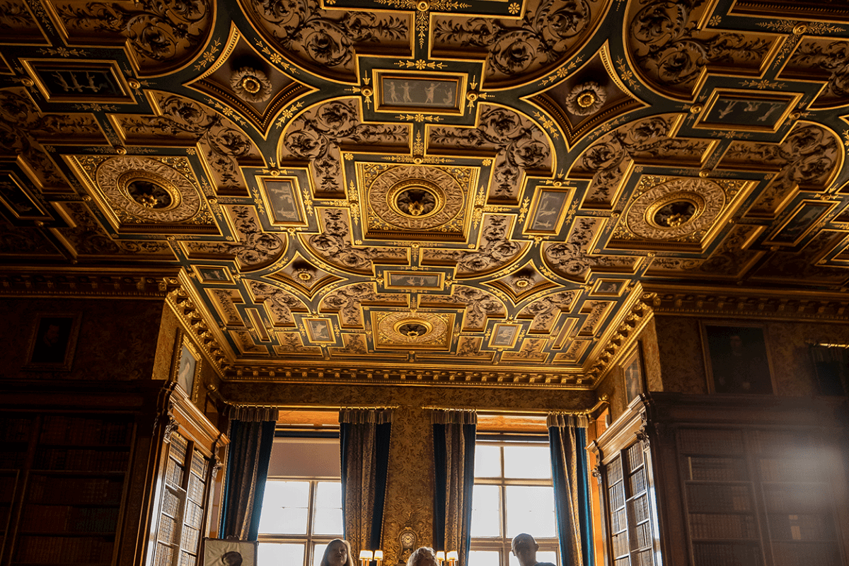 Guest admire the grand ceiling whilst on a tour of Longleat House