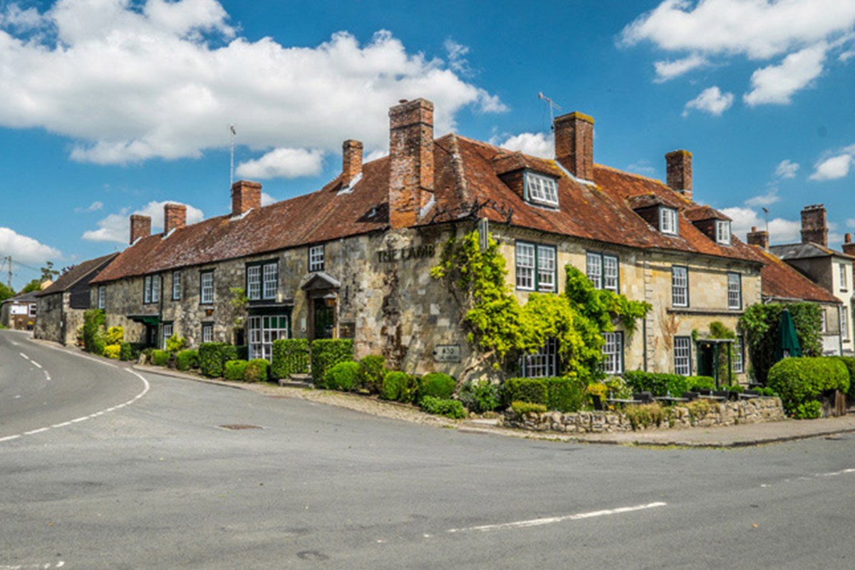 The Lamb Hindon - A country pub on the corner of a road, with climbing plants and a red tiled roof