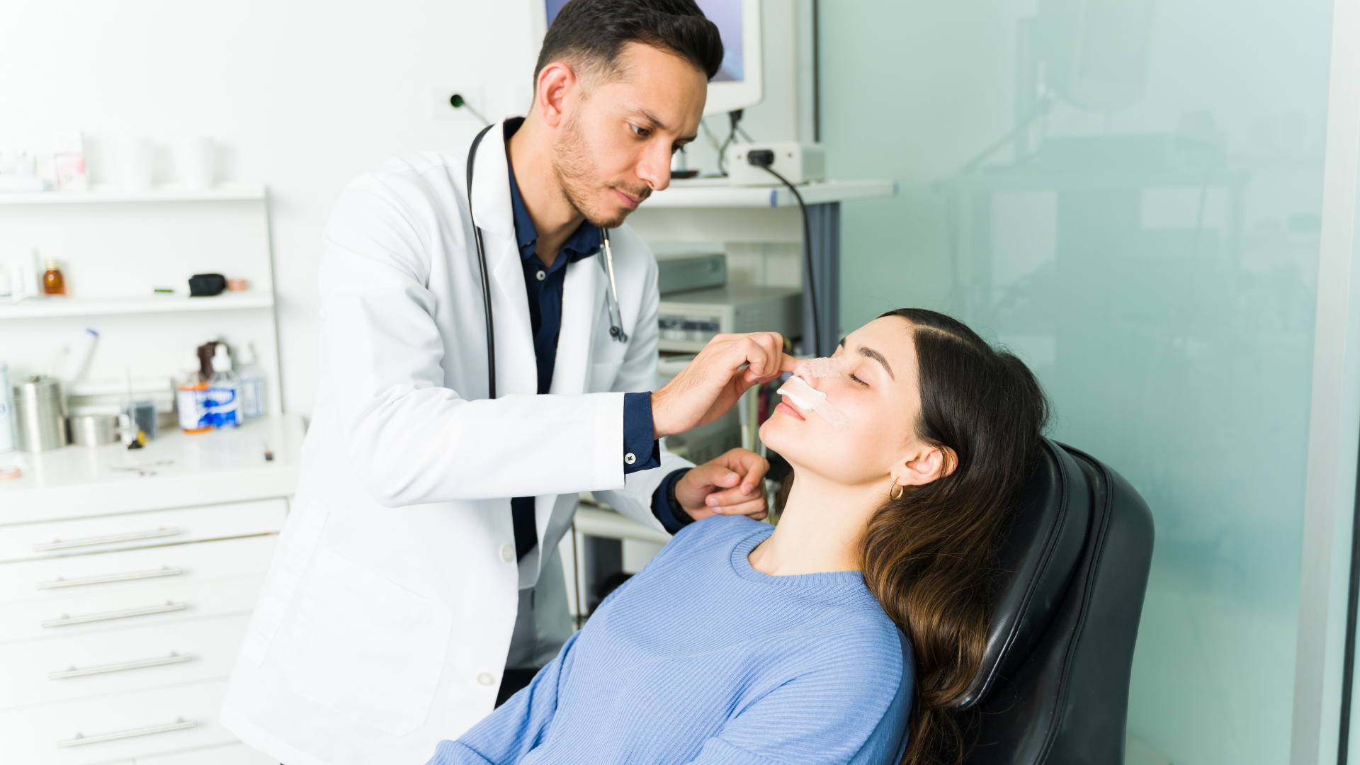 A woman after a rhinoplasty surgery with a surgeon 