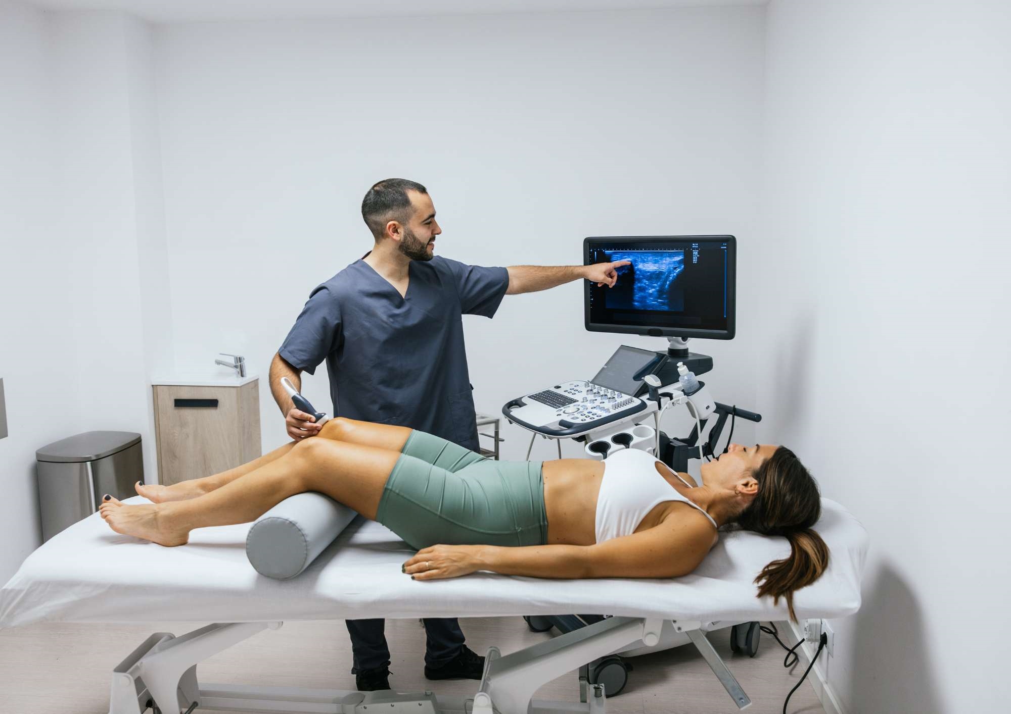 Woman having a Musculoskeletal ultrasound scan Woman having a Musculoskeletal ultrasound scan