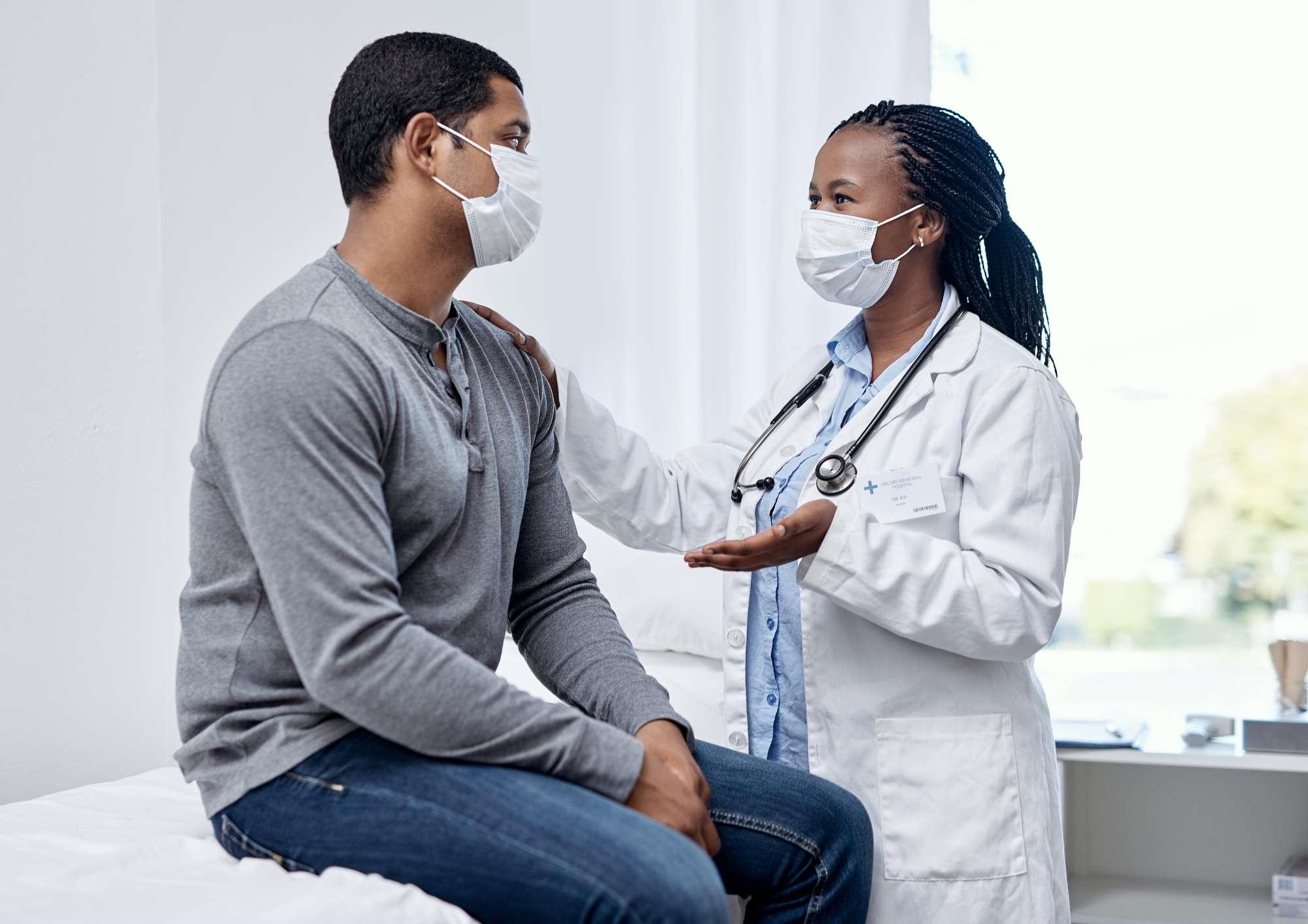 Doctor comforting a patient