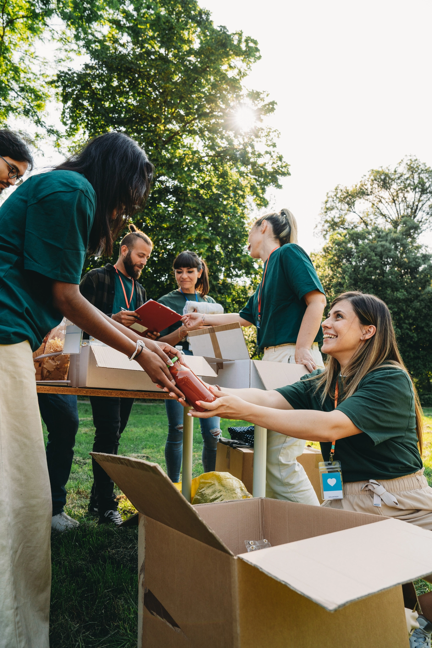 A group of people are working together at a food and clothes bank