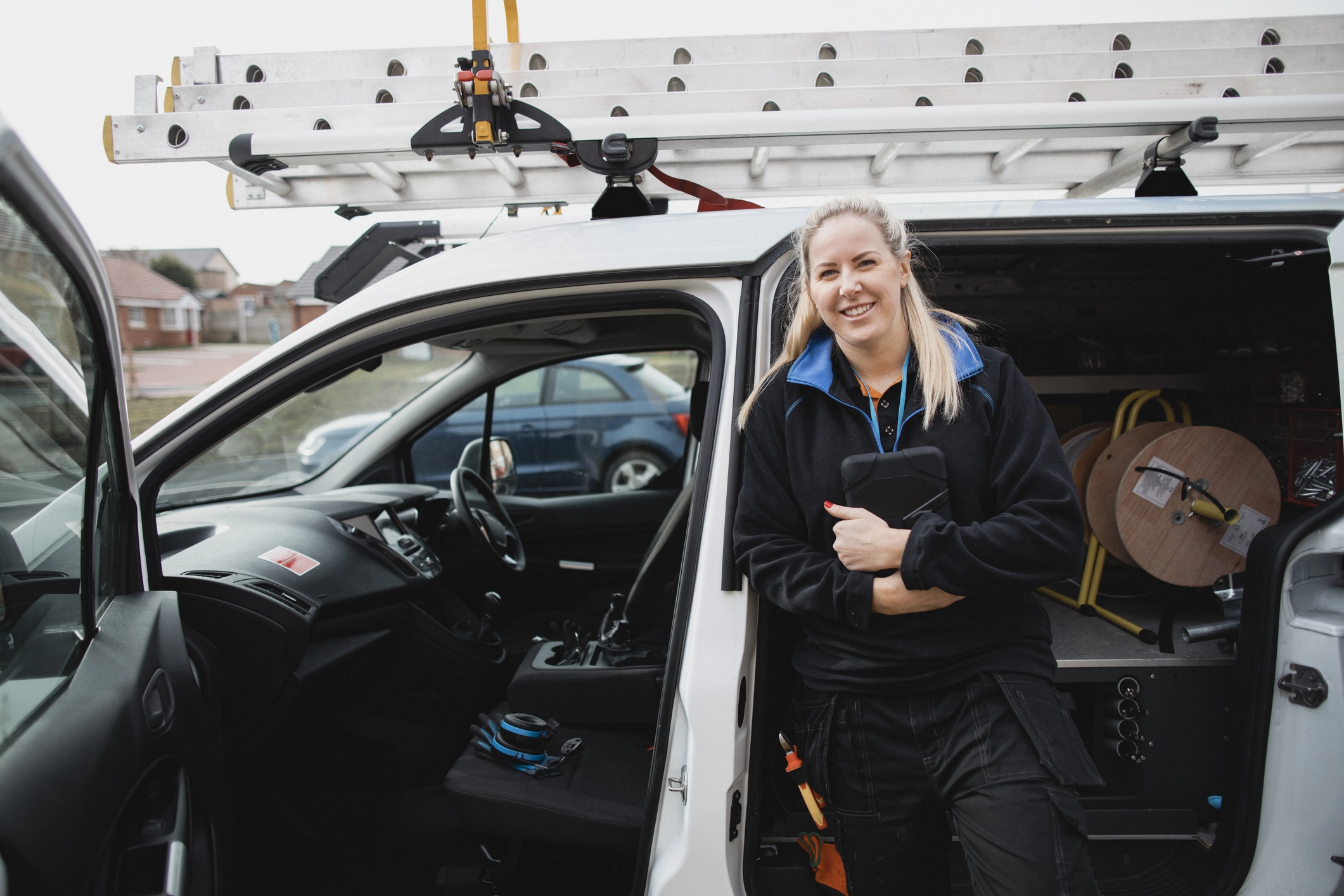 Repairs Female Engineer In Work Van
