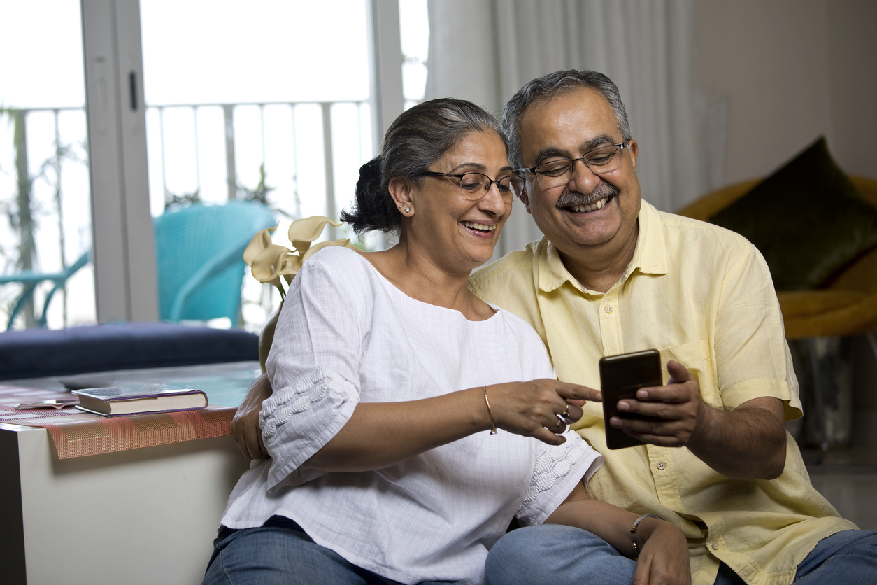 Couple Looking At Mobile Phone