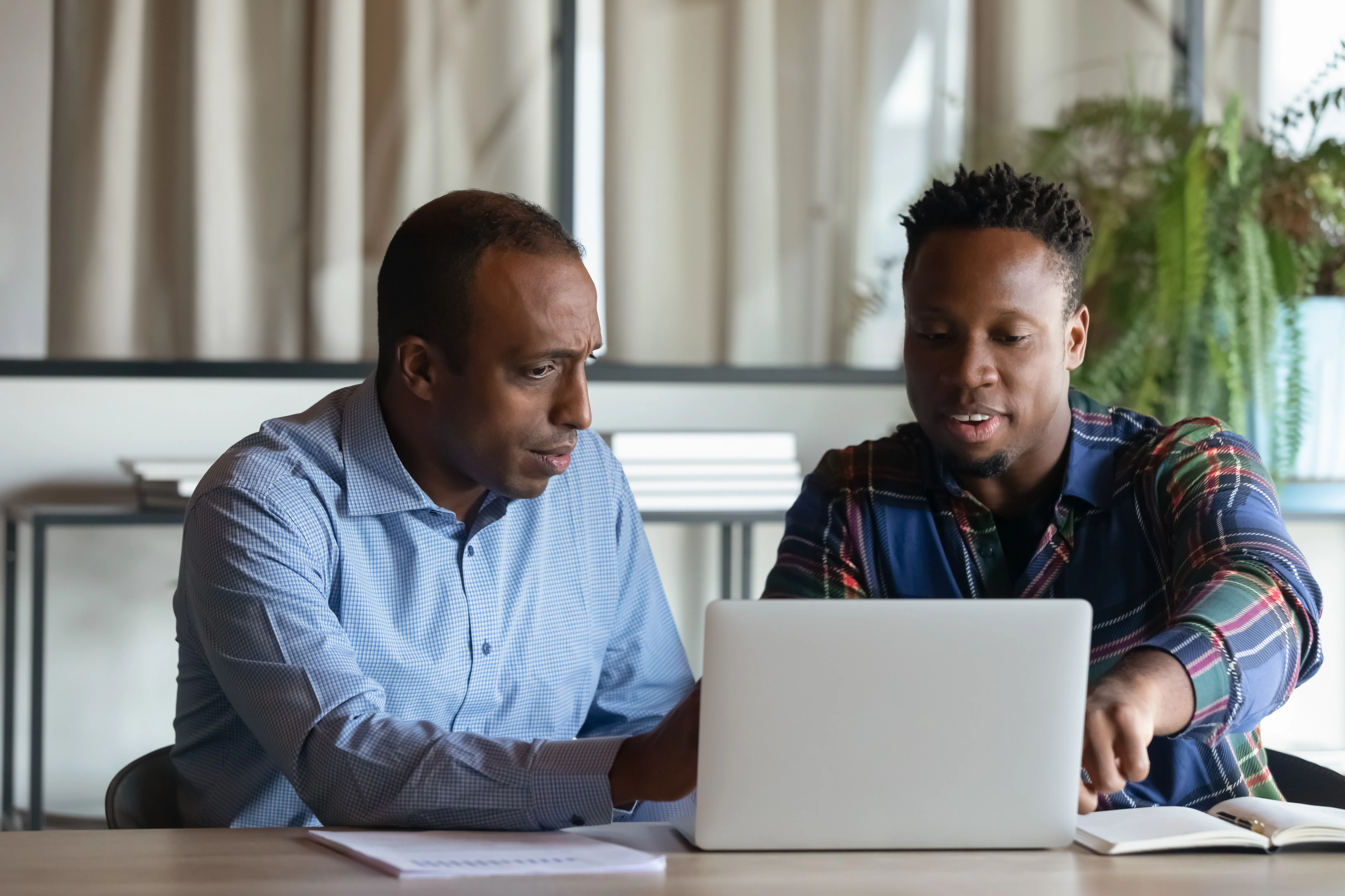 Two Men On Laptop