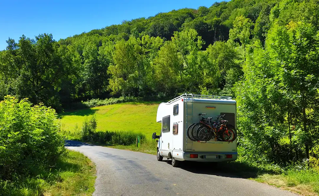 car towing a caravan in the countryside