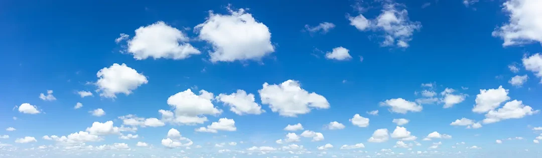 Blue sky with white summer clouds