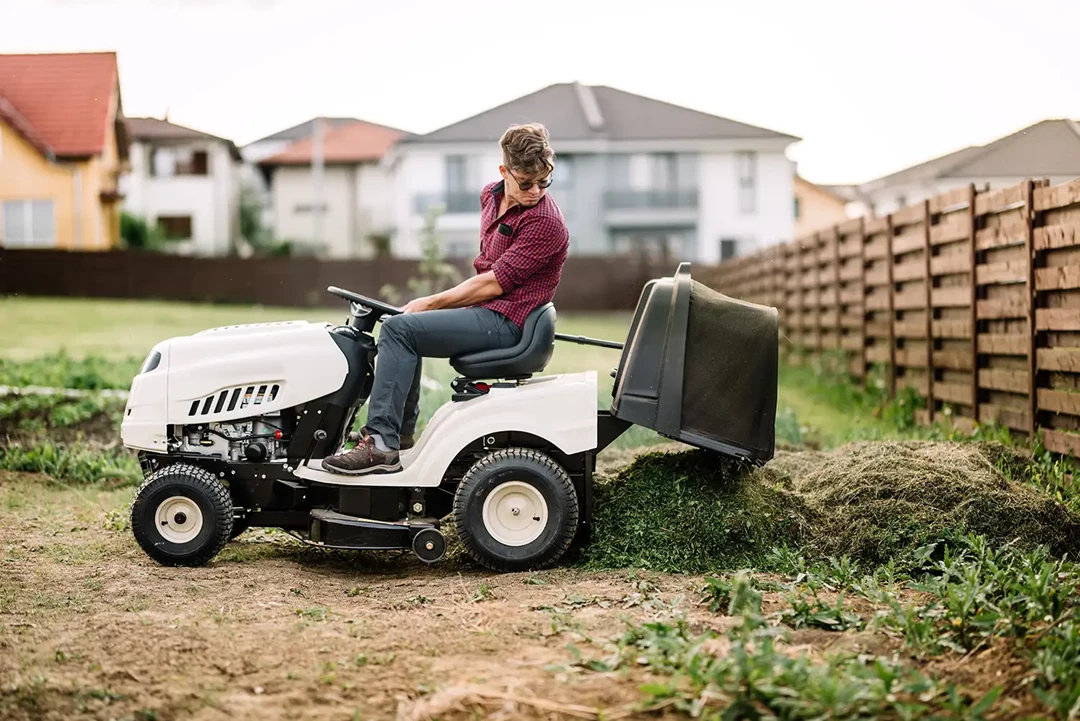 Person on ride on mower