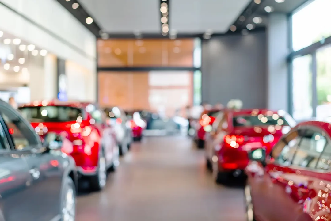 Car showroom with silver and grey new cars