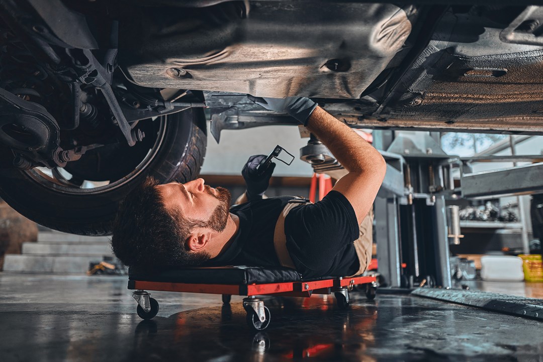 Mechanic fixing a car in a garage