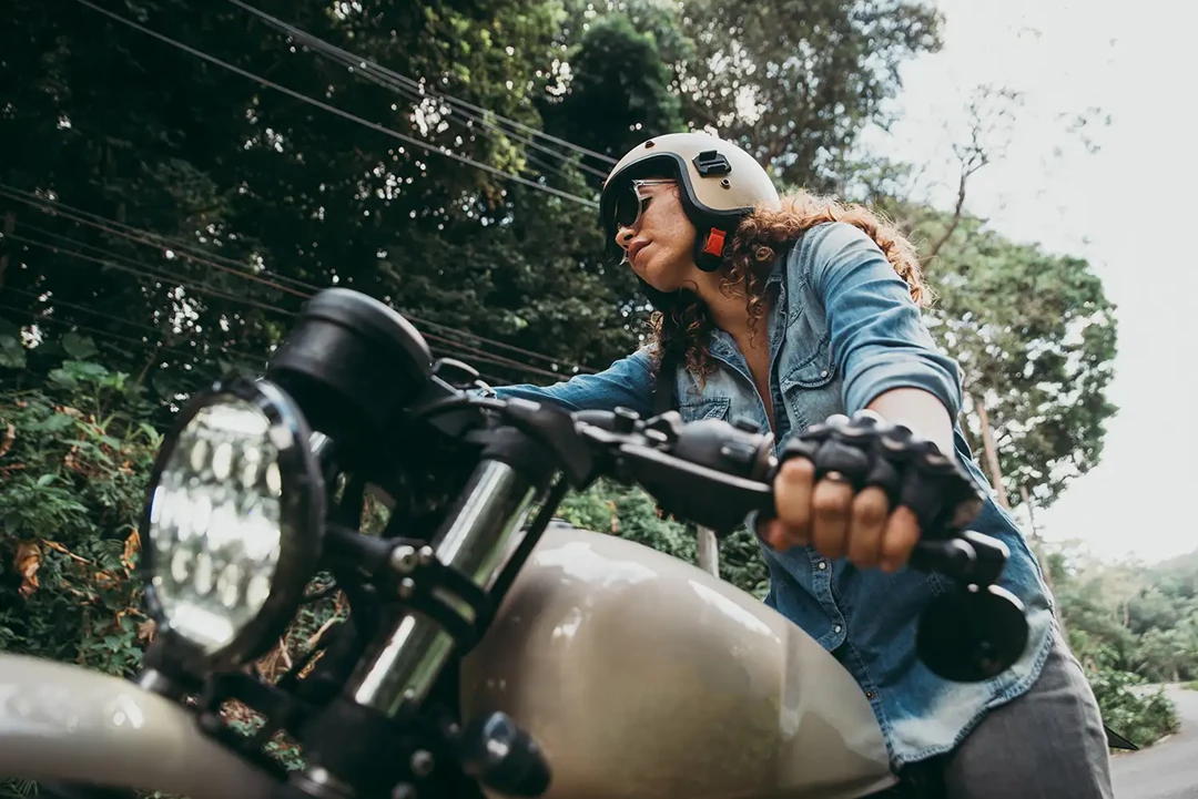 Woman on a motorbike in the countryside