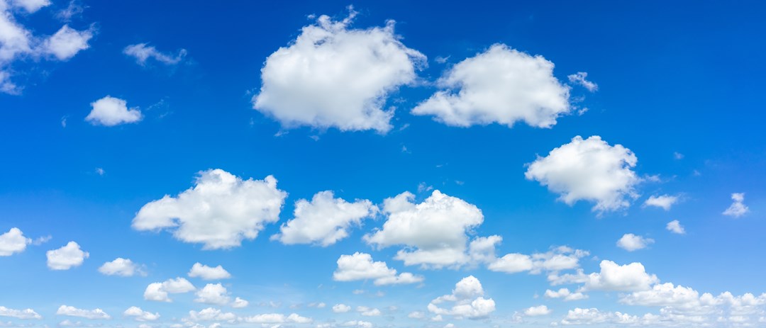 Blue sky with white summer clouds