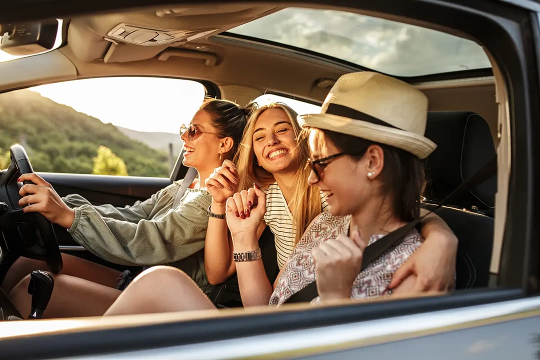 Three young women in a car