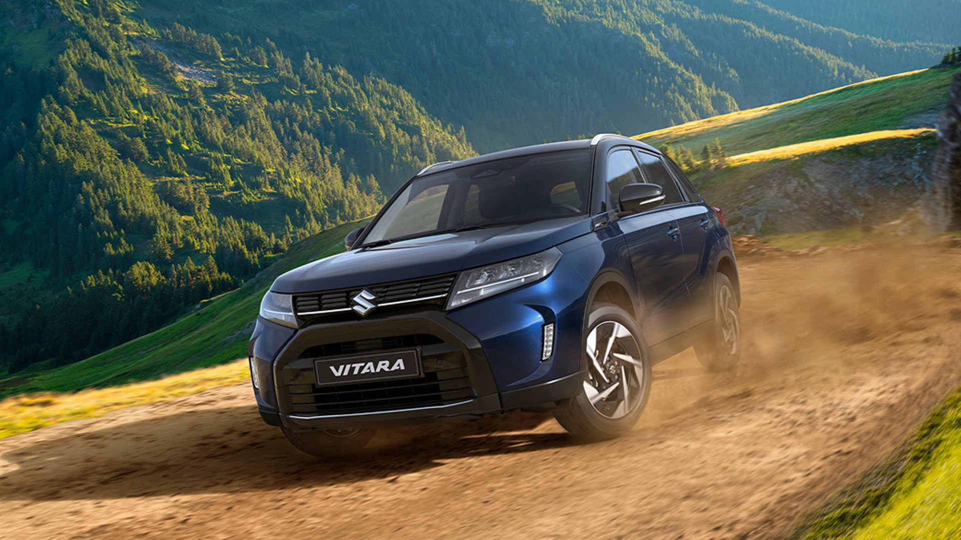 Sphere Blue Suzuki Vitara driving on a mountain road