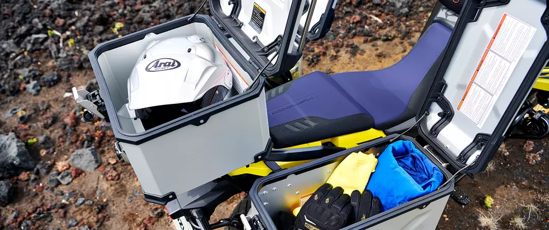 Suzuki V-Strom 1050DE Tour top box and rear right pannier open to demonstrate storage